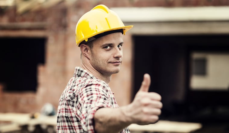 Residential construction worker giving thumbs up